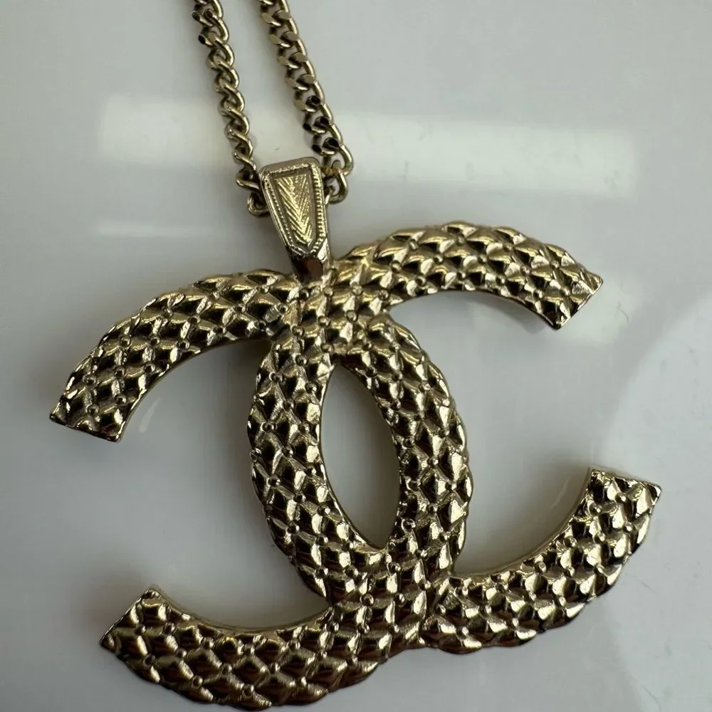 CHANEL Multi Logo Engraved Gold Crystal CC Pendant Necklace